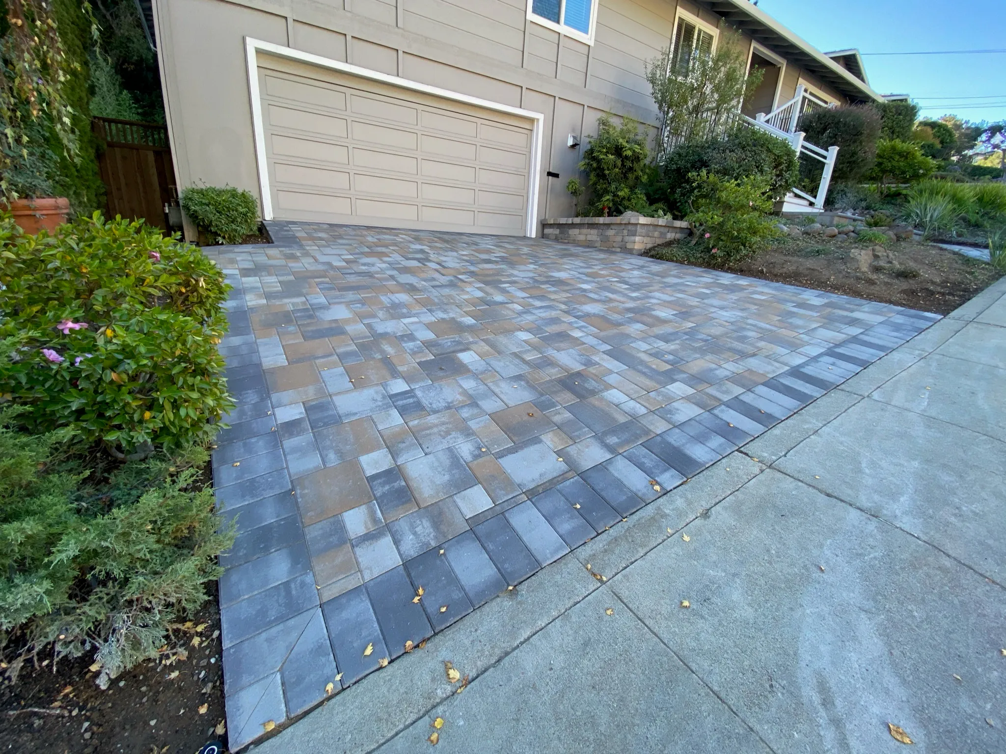 Picture of Unique Pavers transforms driveways with an artful blend of gray and brown pavers, enhancing curb appeal while ensuring durability. The company scored Highest in Quality and Helpful Expertise. Copyright ©2025 Diamond Certified Resource - Unique Pavers