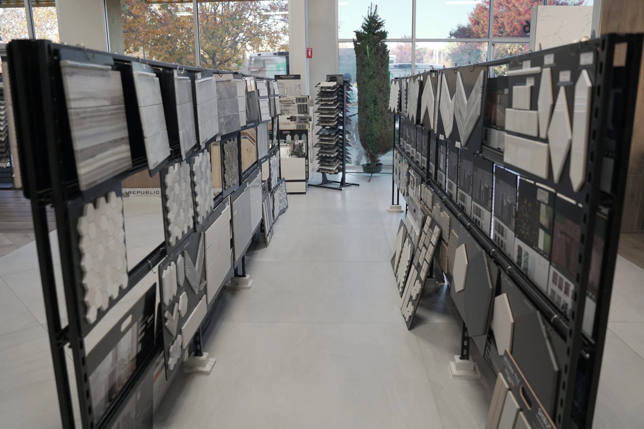 Picture of Within the crisp, well-organized aisles of Today's Kitchen & Bath, a myriad of tile samples awaits discerning eyes, each pattern offering a promise of transformation. Known for their expertise and quality, the company transforms spaces with precision. Copyright ©2025 Diamond Certified Resource - Today's Kitchen & Bath