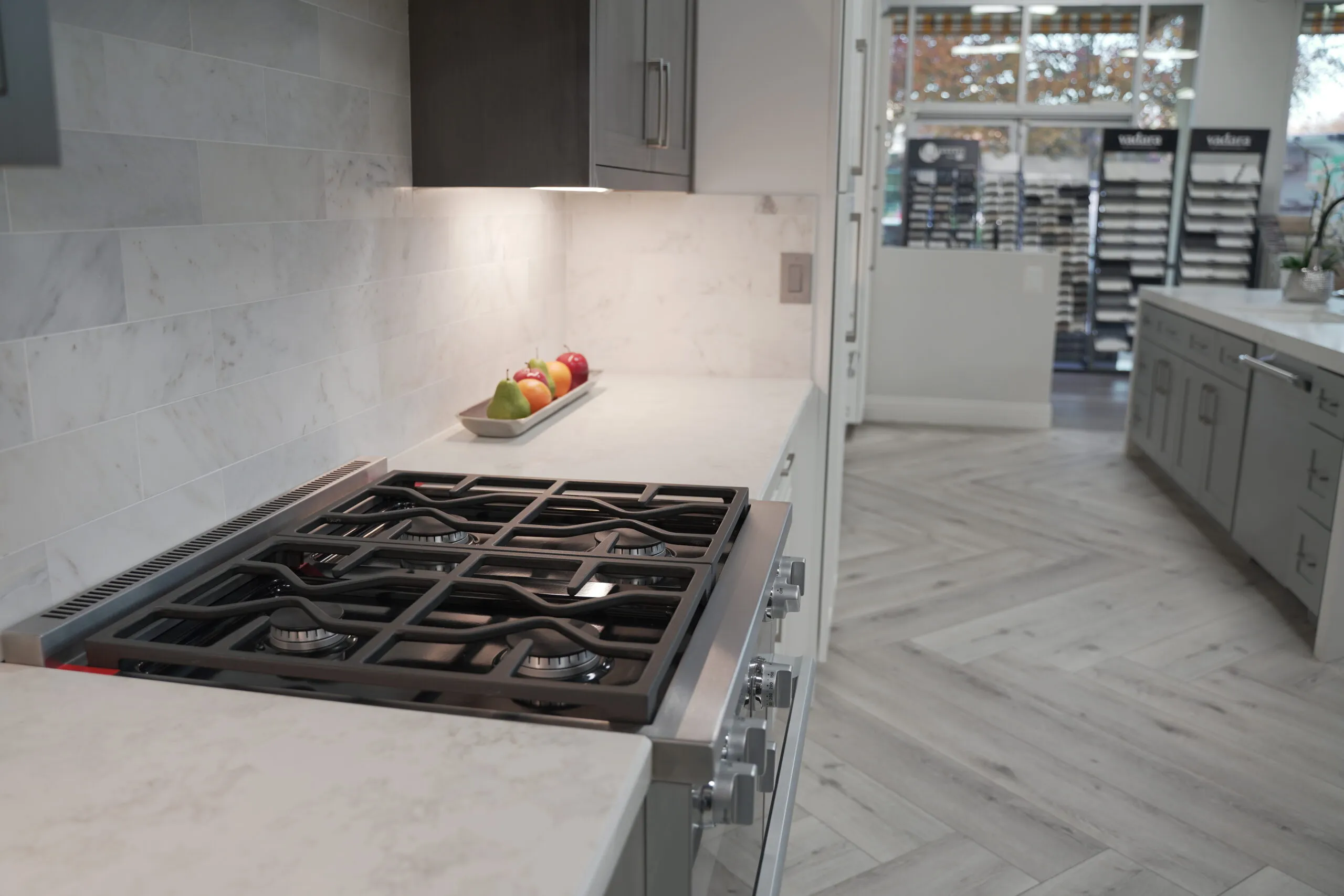 Picture of A sleek, modern stove set against a pristine countertop becomes the centerpiece of this thoughtfully designed kitchen, exemplifying Today's Kitchen & Bath's commitment to quality outcomes. Copyright ©2025 Diamond Certified Resource - Today's Kitchen & Bath