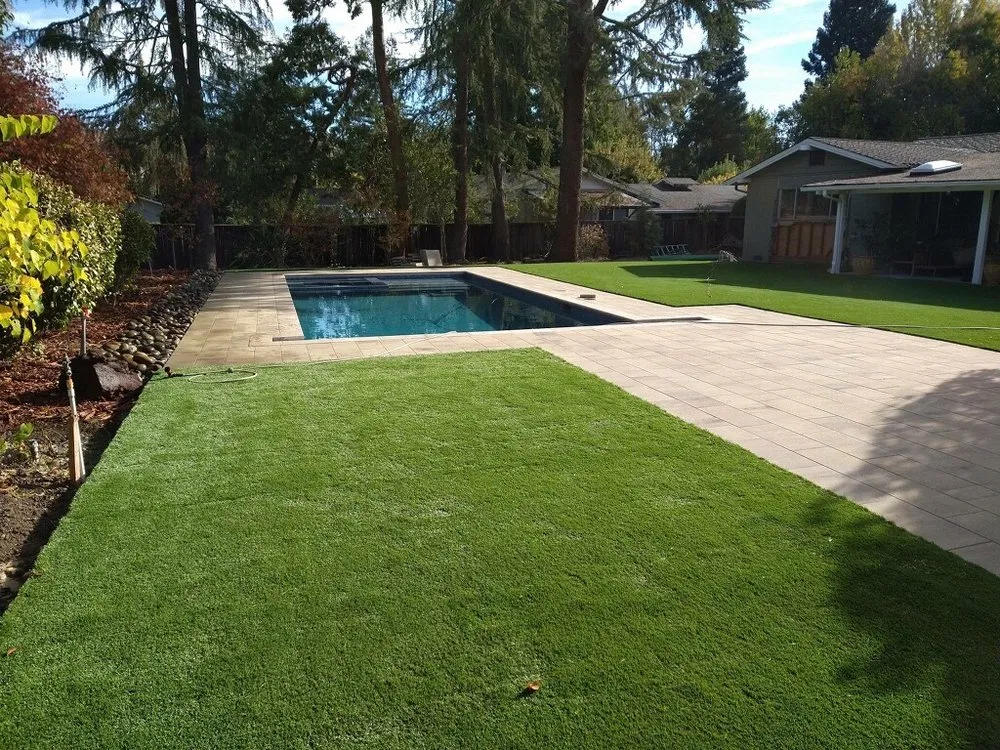 Picture of A serene backyard featuring a pristine pool and neatly laid pavers showcases ARP Hardscape's commitment to quality outcomes. The seamless integration of natural and structured elements exemplifies their expertise. ARP Hardscape has consistently achieved a Highest in Quality rating. Copyright ©2025 Diamond Certified Resource

 - ARP Hardscape