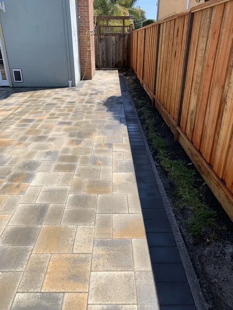 Picture of A meticulously laid patio showcases ARP Hardscape's commitment to quality outcomes, reflecting light and symmetry. This installation exemplifies their recognition for expertise and quality. Copyright ©2025 Diamond Certified Resource - ARP Hardscape