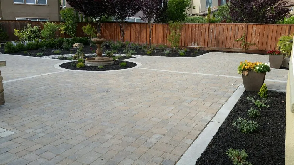 Picture of ARP Hardscape unveils a meticulously crafted patio, surrounded by lush greenery and adorned with a central fountain. This space exemplifies their focus on quality outcomes, creating inviting outdoor environments. Copyright ©2025 Diamond Certified Resource

 - ARP Hardscape