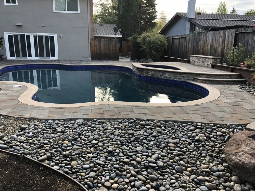 Picture of The serene elegance of a meticulously crafted poolscape reflects ARP Hardscape's commitment to quality outcomes. Known for their top-rated attention to detail, they transform outdoor spaces into tranquil retreats. Copyright ©2025 Diamond Certified Resource - ARP Hardscape