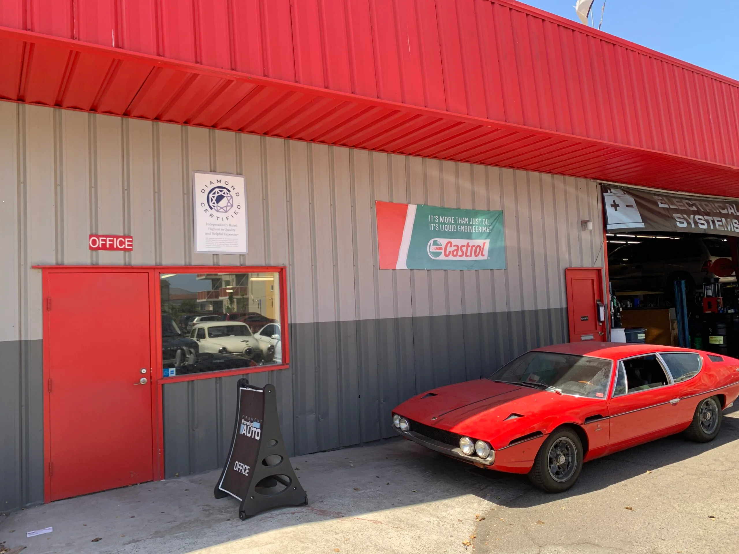 Picture of A classic red car parked at Fremont Foreign Auto, reflecting the company's dedication to maintaining quality outcomes. Known for high customer satisfaction ratings, they ensure every vehicle is treated with care. Copyright ©2025 Diamond Certified Resource - Fremont Foreign Auto