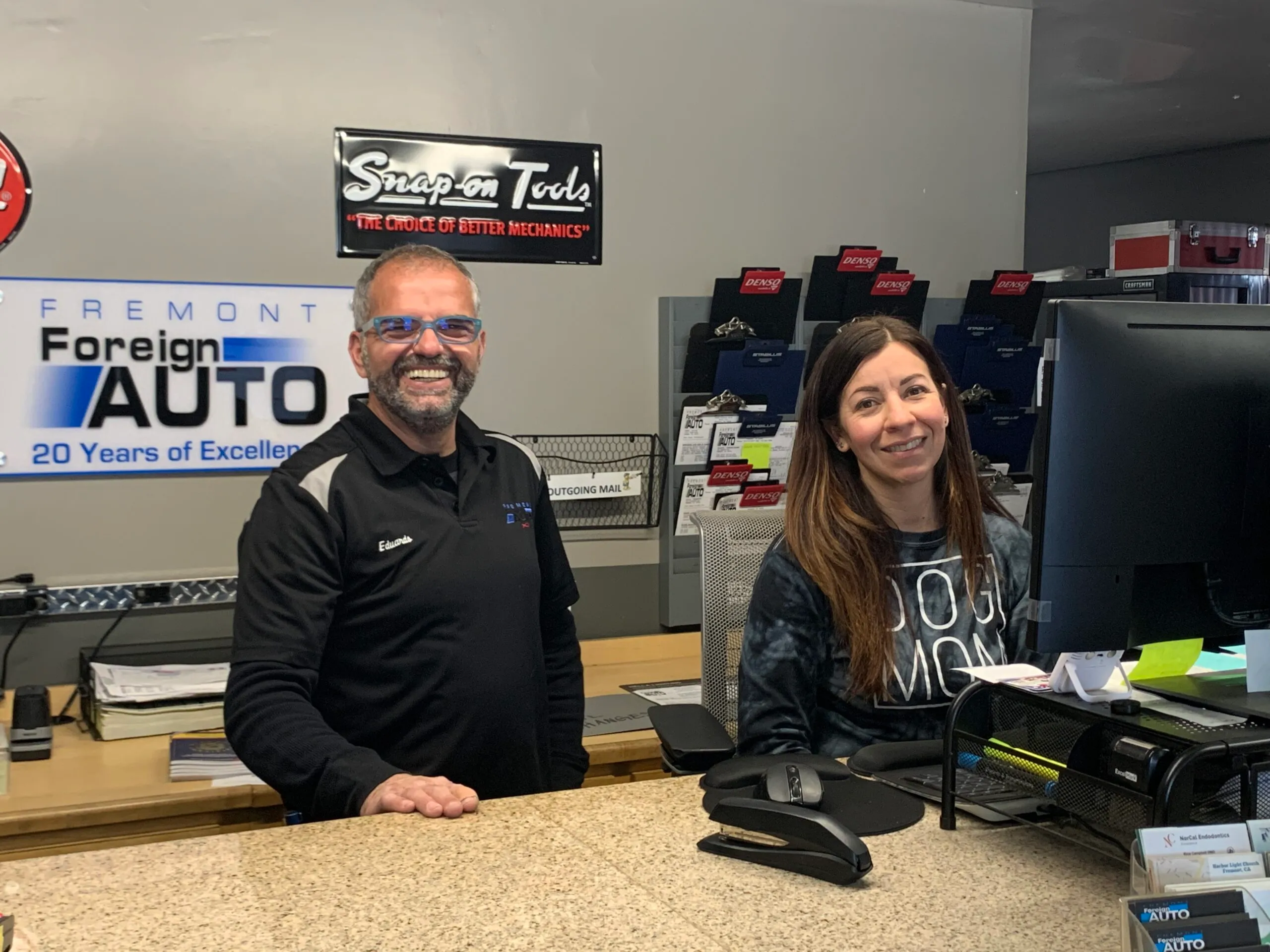 Picture of Inside Fremont Foreign Auto, two team members share a welcoming smile behind the counter, a testament to the companyâ€™s focus on quality outcomes and customer satisfaction. Copyright ©2025 Diamond Certified Resource

 - Fremont Foreign Auto
