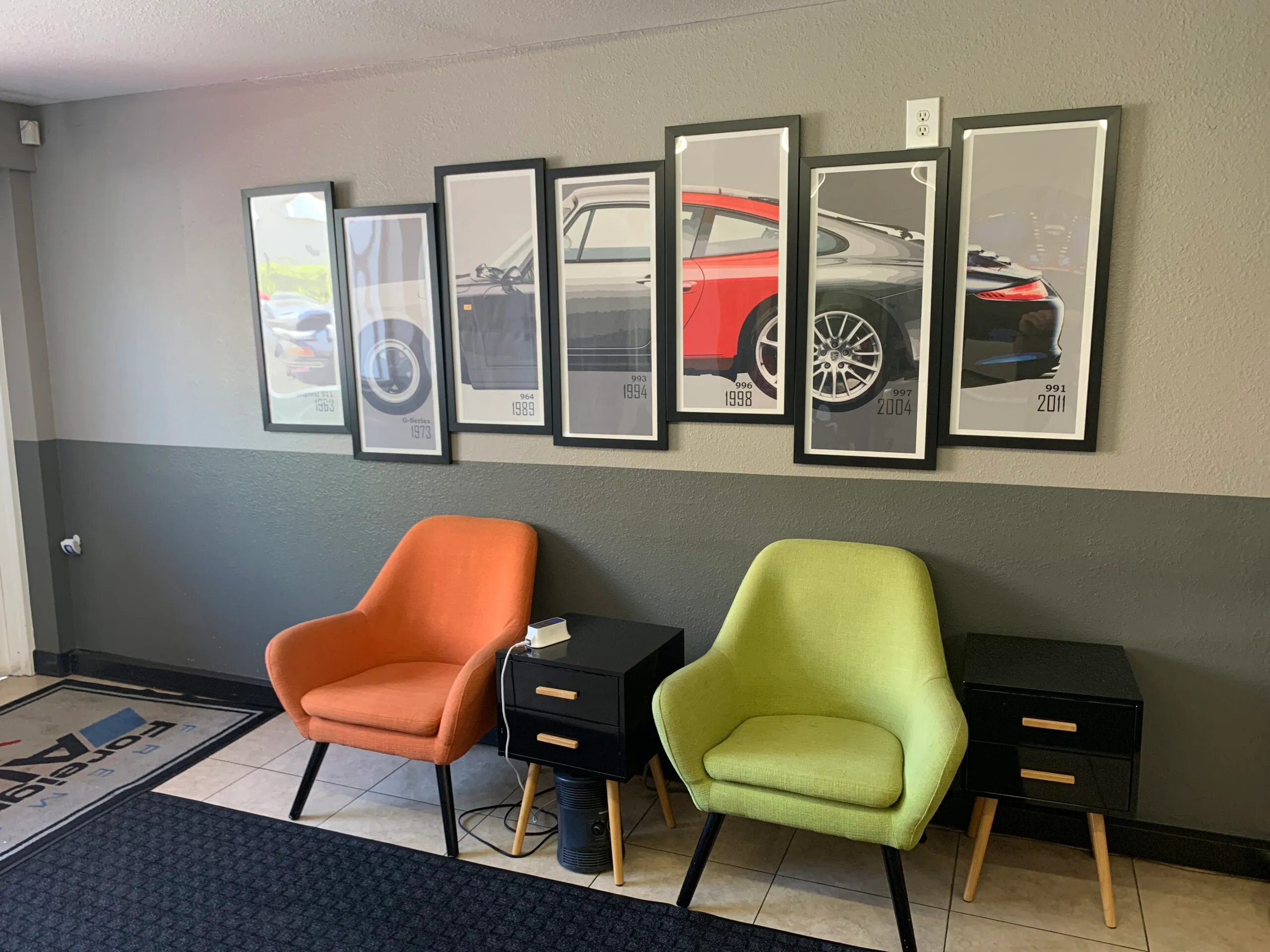 Picture of In Fremont Foreign Auto's welcoming lounge, a series of framed automotive prints narrates a journey through design evolution, reflecting the companyâ€™s recognition for expertise and quality. Copyright ©2025 Diamond Certified Resource

 - Fremont Foreign Auto