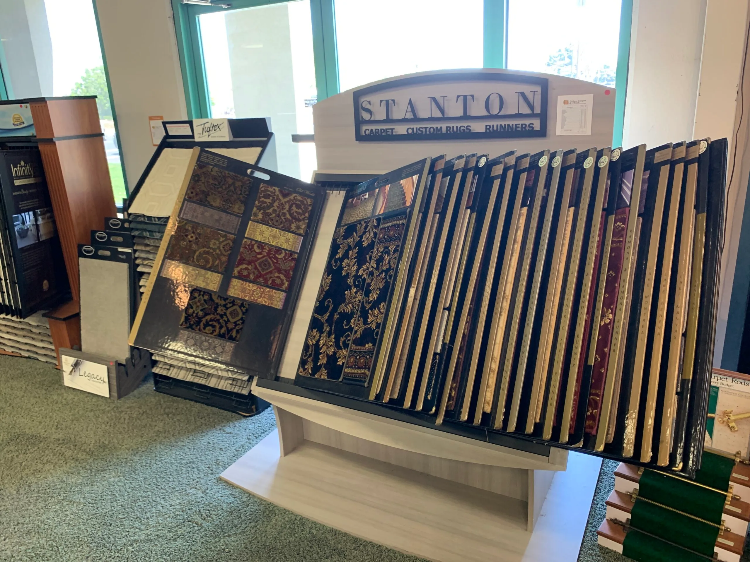 Picture of A curated selection of ornate carpet samples at Abbey Carpets by Fashion Floors invites customers to explore quality and artistry. Recognized for expertise and quality, the company ensures each choice meets the highest standards. Copyright ©2025 Diamond Certified Resource - Abbey Carpets by Fashion Floors