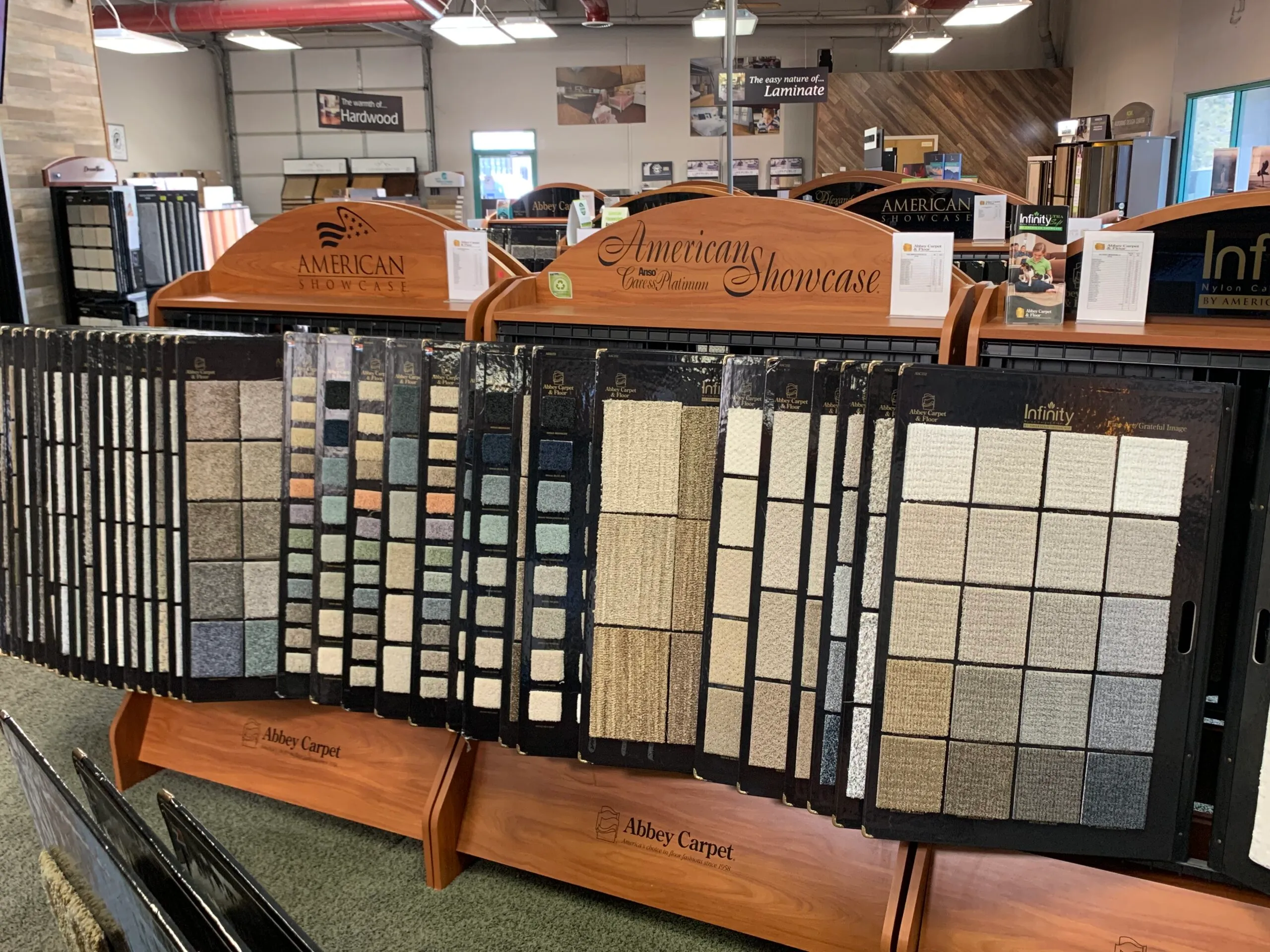 Picture of In the inviting showroom of Abbey Carpets by Fashion Floors, a display of meticulously arranged carpet samples showcases the company's dedication to quality outcomes. Recognized for their expertise, they offer a wide range of textures and colors, catering to diverse tastes and needs. Copyright ©2025 Diamond Certified Resource

 - Abbey Carpets by Fashion Floors