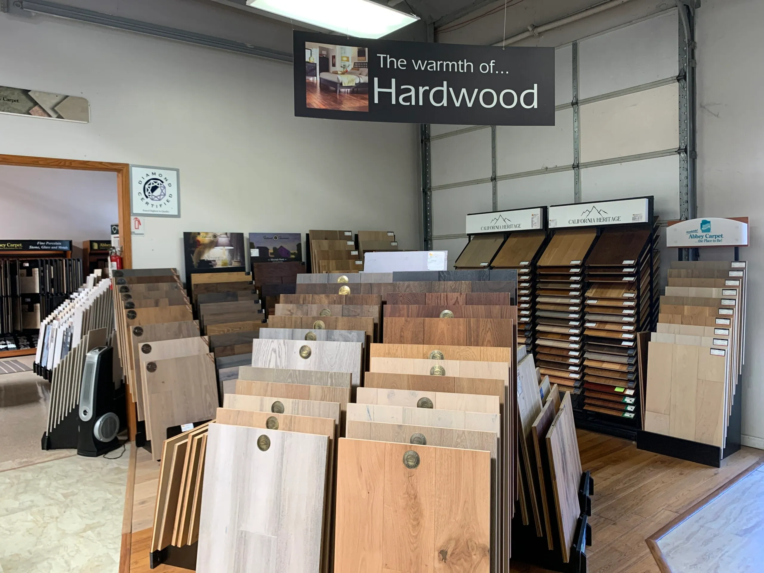 Picture of The showroom at Abbey Carpets by Fashion Floors showcases a diverse array of hardwood flooring options, inviting customers to explore the warmth of quality craftsmanship. The company consistently achieved a Highest in Quality rating, underscoring its commitment to excellence. Copyright ©2025 Diamond Certified Resource - Abbey Carpets by Fashion Floors