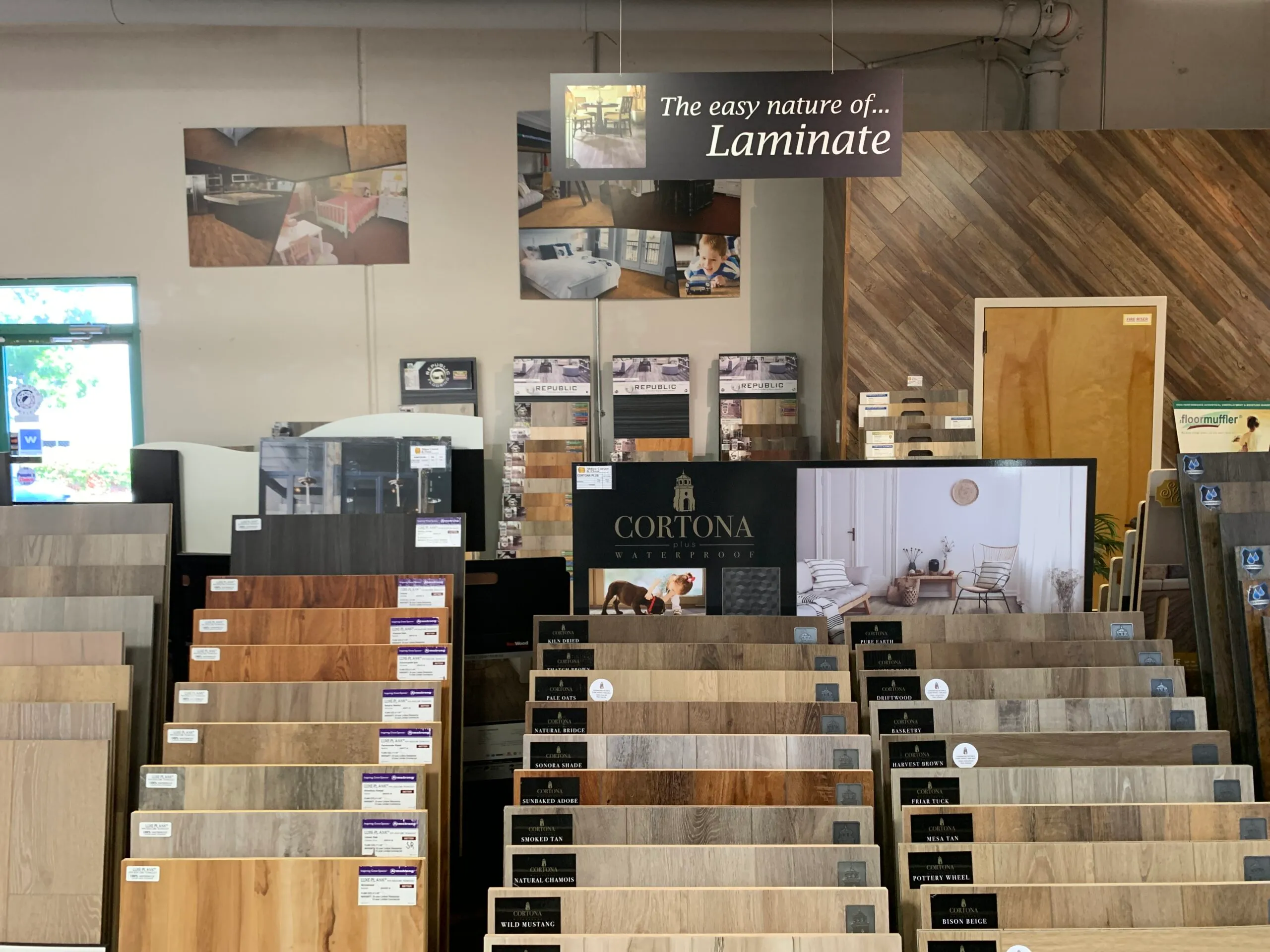 Picture of In a quiet showroom corner, Abbey Carpets by Fashion Floors showcases an array of laminate options, inviting imagination and choice. The company's focus on quality outcomes is evident in the curated selection. Copyright ©2025 Diamond Certified Resource - Abbey Carpets by Fashion Floors