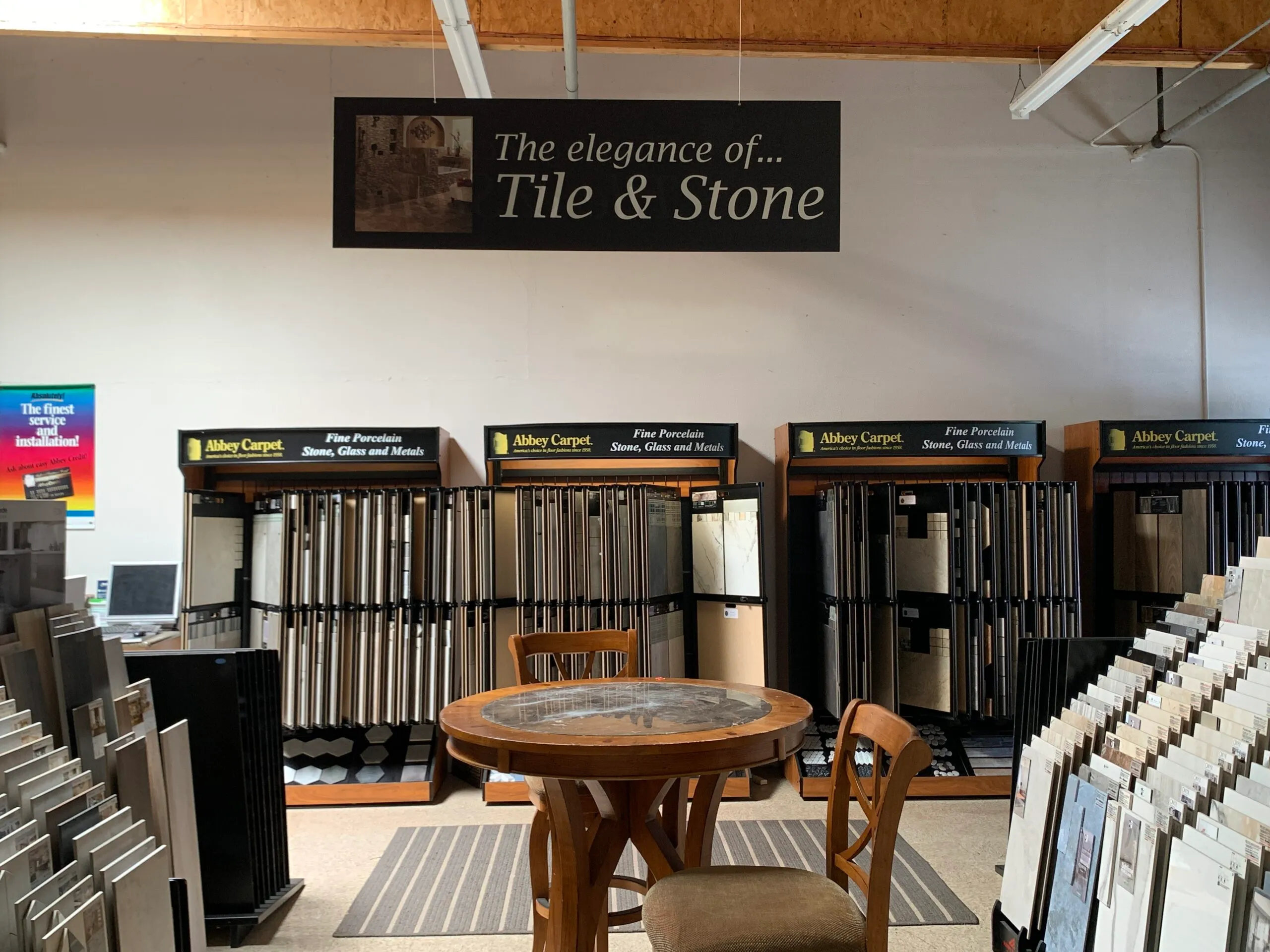 Picture of A serene showcase of tile and stone samples at Abbey Carpets by Fashion Floors invites customers to explore quality flooring options. Consistently achieving a Highest in Quality rating, the company transforms spaces with elegance and expertise. Copyright ©2025 Diamond Certified Resource

 - Abbey Carpets by Fashion Floors