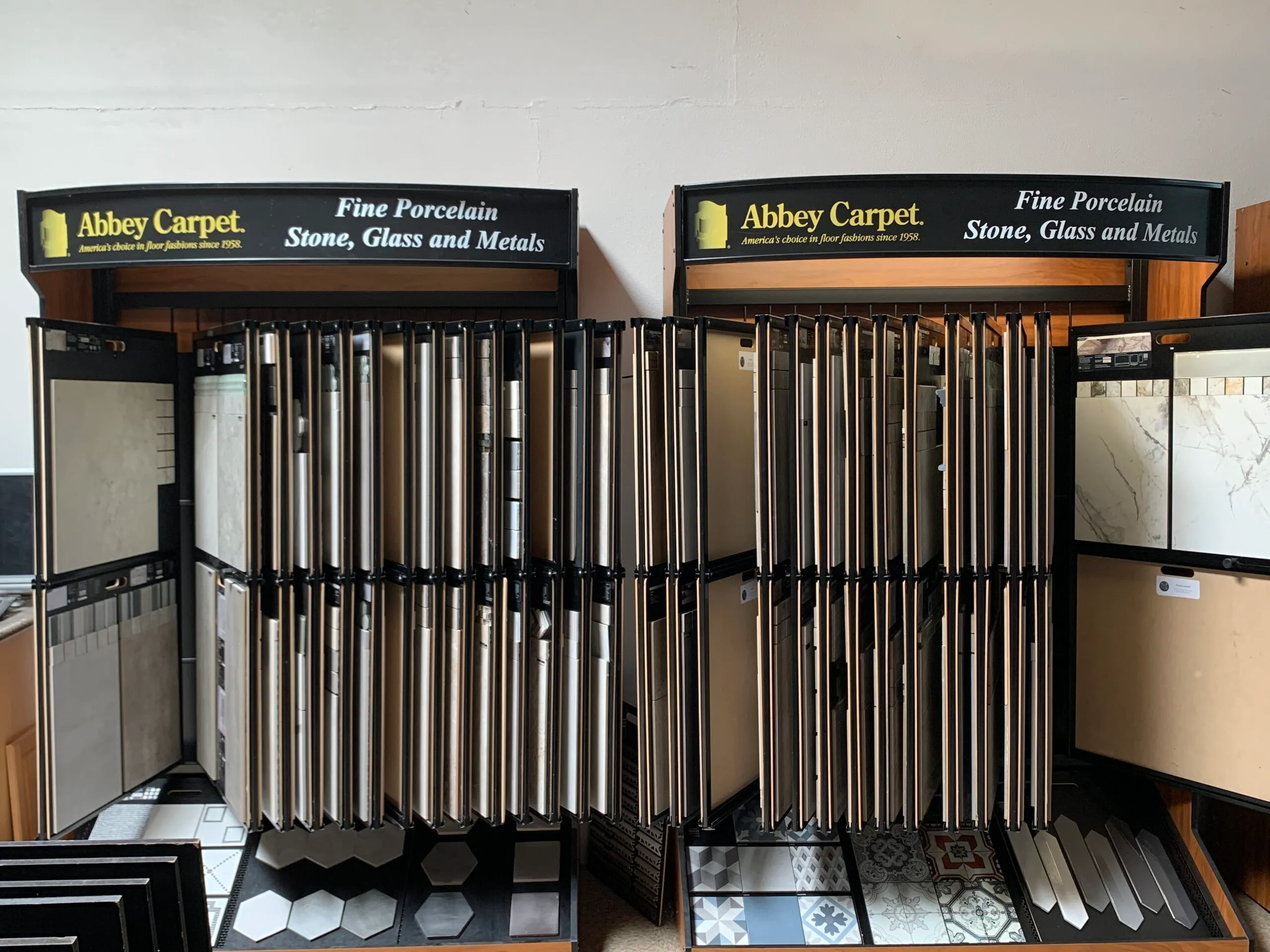 Picture of Abbey Carpets by Fashion Floors showcases a diverse range of fine porcelain, stone, glass, and metal flooring options, reflecting its commitment to quality outcomes. The neatly arranged displays hint at a dedication to craftsmanship and customer satisfaction. Copyright ©2025 Diamond Certified Resource - Abbey Carpets by Fashion Floors