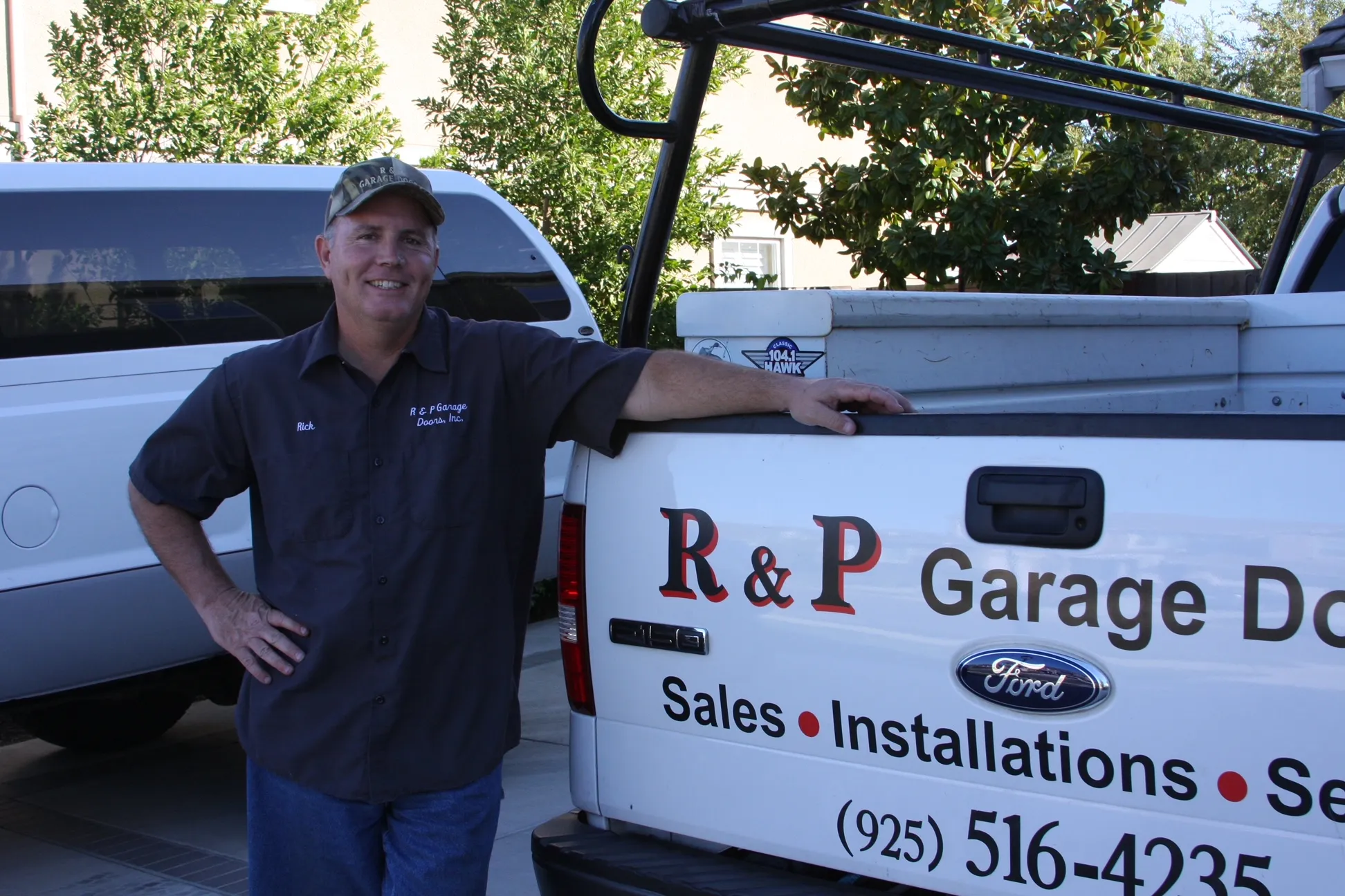 Picture of A proud representative of R & P Garage Doors stands beside the company truck, embodying the commitment to high customer satisfaction ratings. Copyright ©2025 Diamond Certified Resource

 - R & P Garage Doors