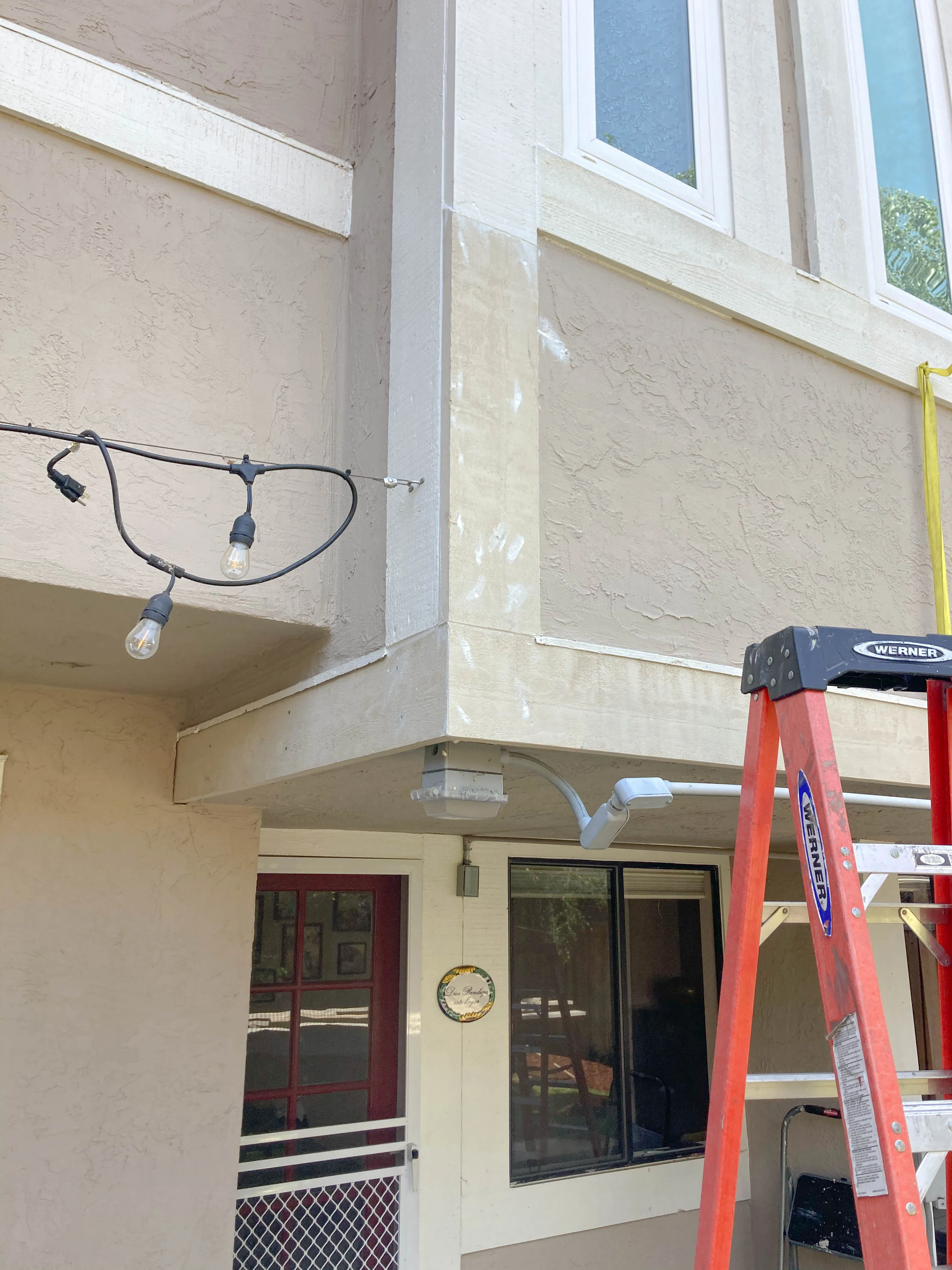 Picture of A ladder rests against the exterior of a stucco house, hinting at ongoing maintenance. Great Wall Termite Control ensures homes are protected with expert care and attention to detail, consistently achieving a Highest in Quality rating. Copyright ©2025 Diamond Certified Resource - Great Wall Termite Control