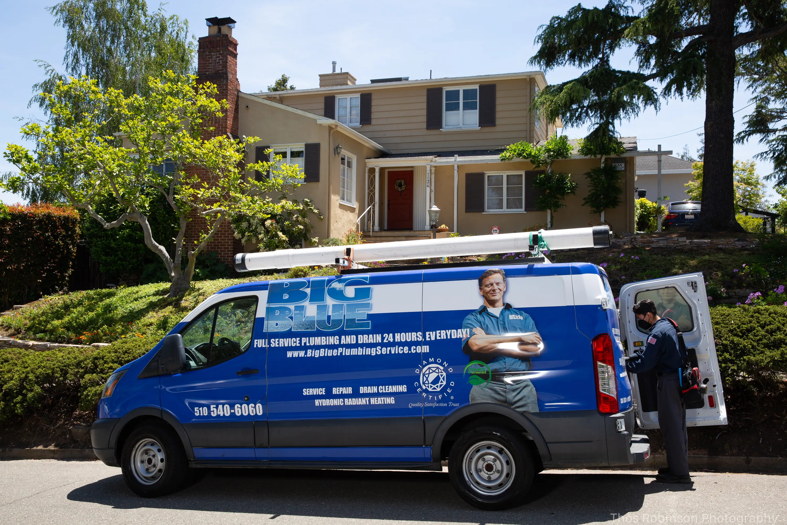 Picture of A Big Blue Plumbing technician, known for high customer satisfaction ratings, prepares equipment at a suburban home, ensuring quality service for all plumbing needs. Copyright ©2025 Diamond Certified Resource

 - Big Blue Plumbing