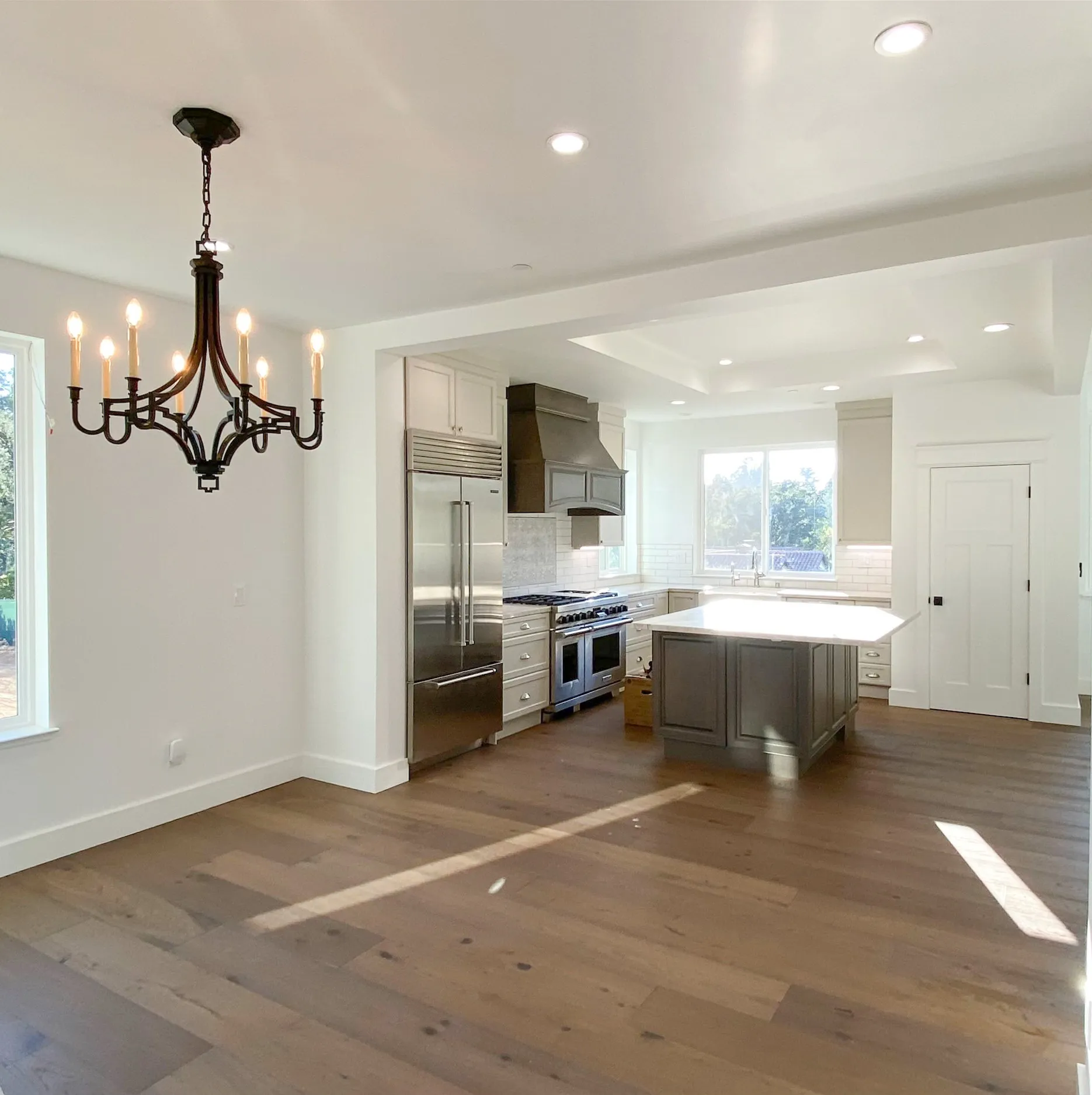 Picture of A newly renovated kitchen gleams under a stylish chandelier, reflecting Mana Construction Inc.'s commitment to quality outcomes. The spacious layout and modern fixtures embody the company's recognition for expertise and quality. Copyright ©2025 Diamond Certified Resource

 - Mana Construction Inc.