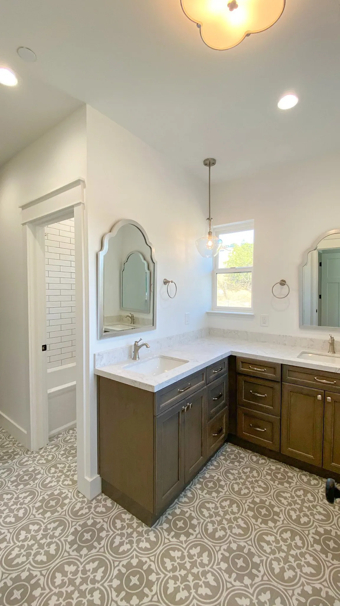 Picture of Mana Construction Inc. showcases a beautifully renovated bathroom, highlighting their craftsmanship with intricate tile patterns and elegant fixtures. The company is top rated for Quality, ensuring exceptional outcomes in every project. Copyright ©2025 Diamond Certified Resource

 - Mana Construction Inc.