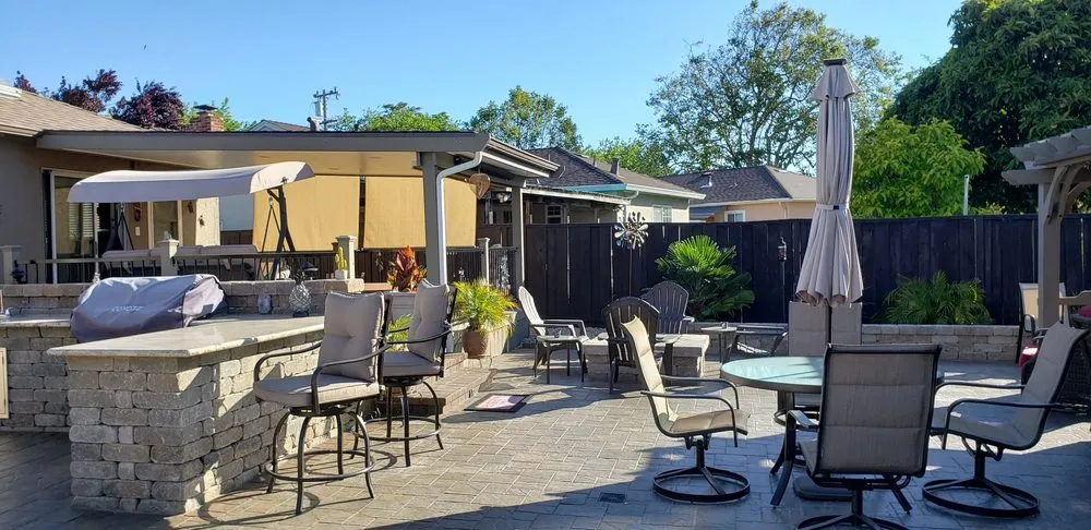 Picture of A serene backyard oasis crafted by ARP Hardscape, where comfort meets elegance. The meticulously arranged seating and stonework hint at the companyâ€™s dedication to quality outcomes. Recognized for expertise and quality. Copyright ©2025 Diamond Certified Resource

 - ARP Hardscape