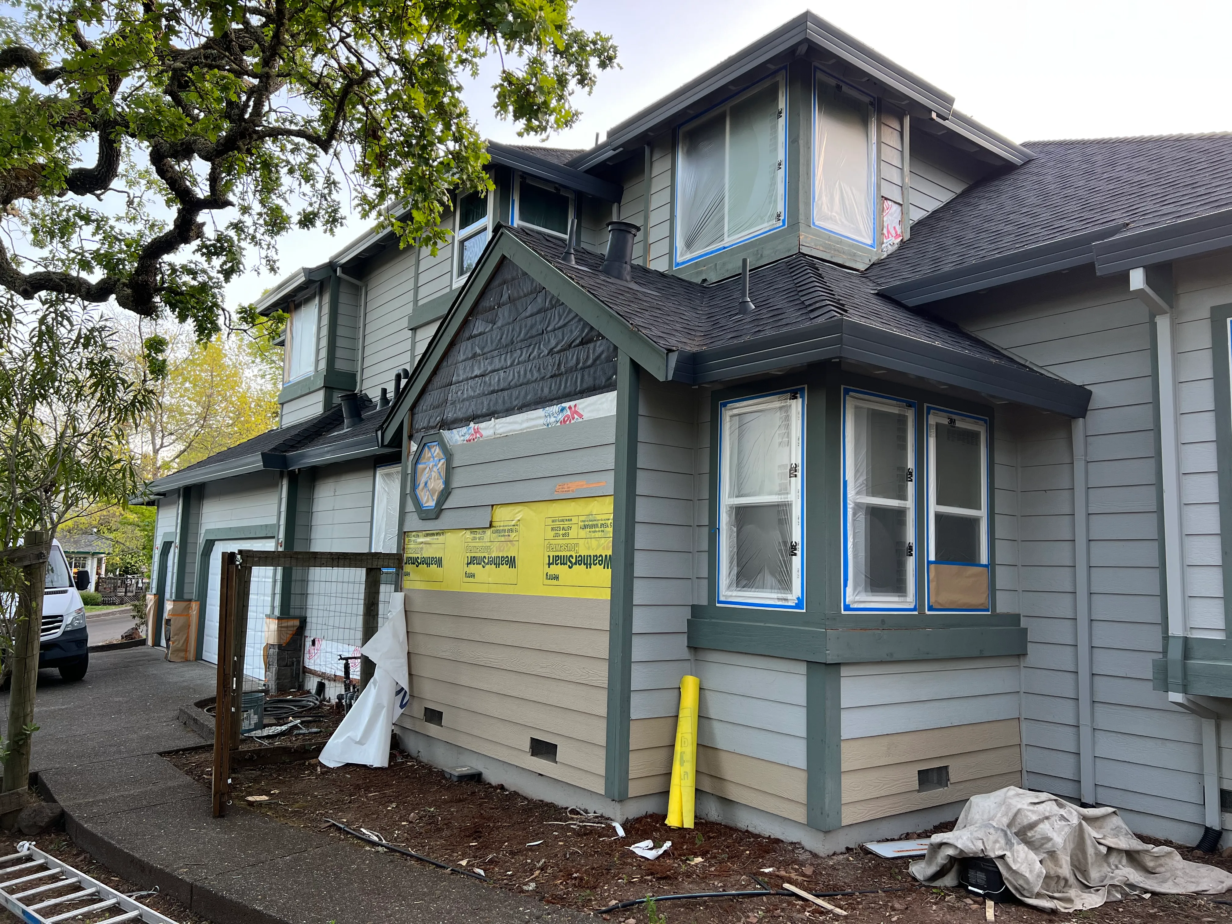 Picture of Amidst the subtle chaos of renovation, the careful application of WeatherSmart wrap hints at a meticulous process by Solidarity Painting, Inc., illustrating their focus on quality outcomes. Copyright ©2025 Diamond Certified Resource - Solidarity Painting, Inc.