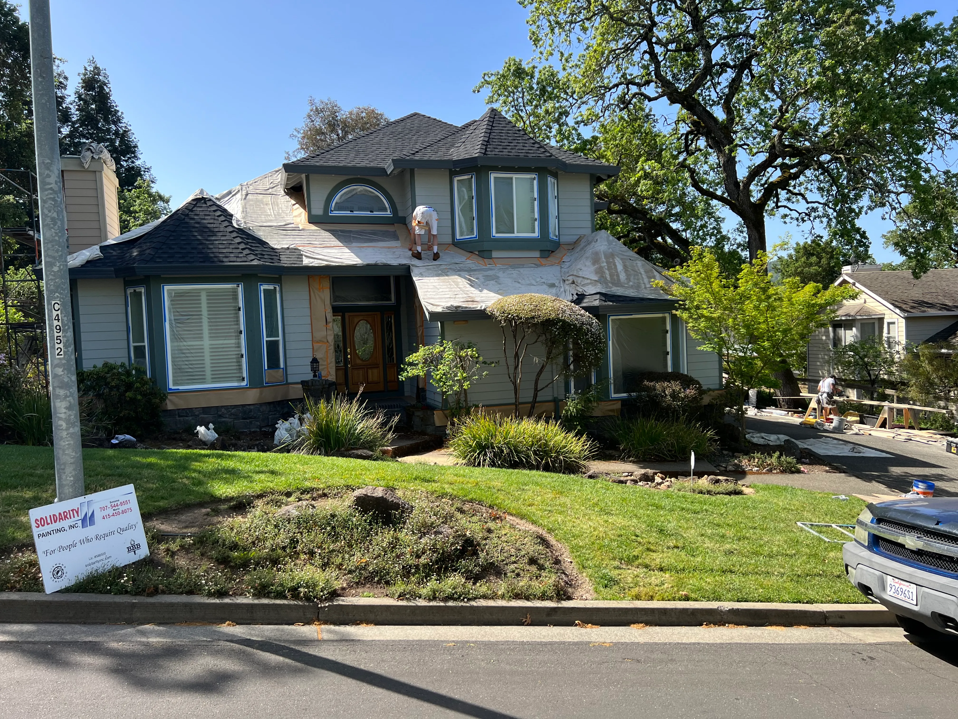 Picture of A craftsman from Solidarity Painting, Inc. skillfully tends to the intricate details of a home's exterior, embodying the companyâ€™s dedication to quality outcomes. Solidarity Painting, Inc. consistently achieves the Highest in Quality rating, reflecting their commitment to excellence. Copyright ©2025 Diamond Certified Resource

 - Solidarity Painting, Inc.