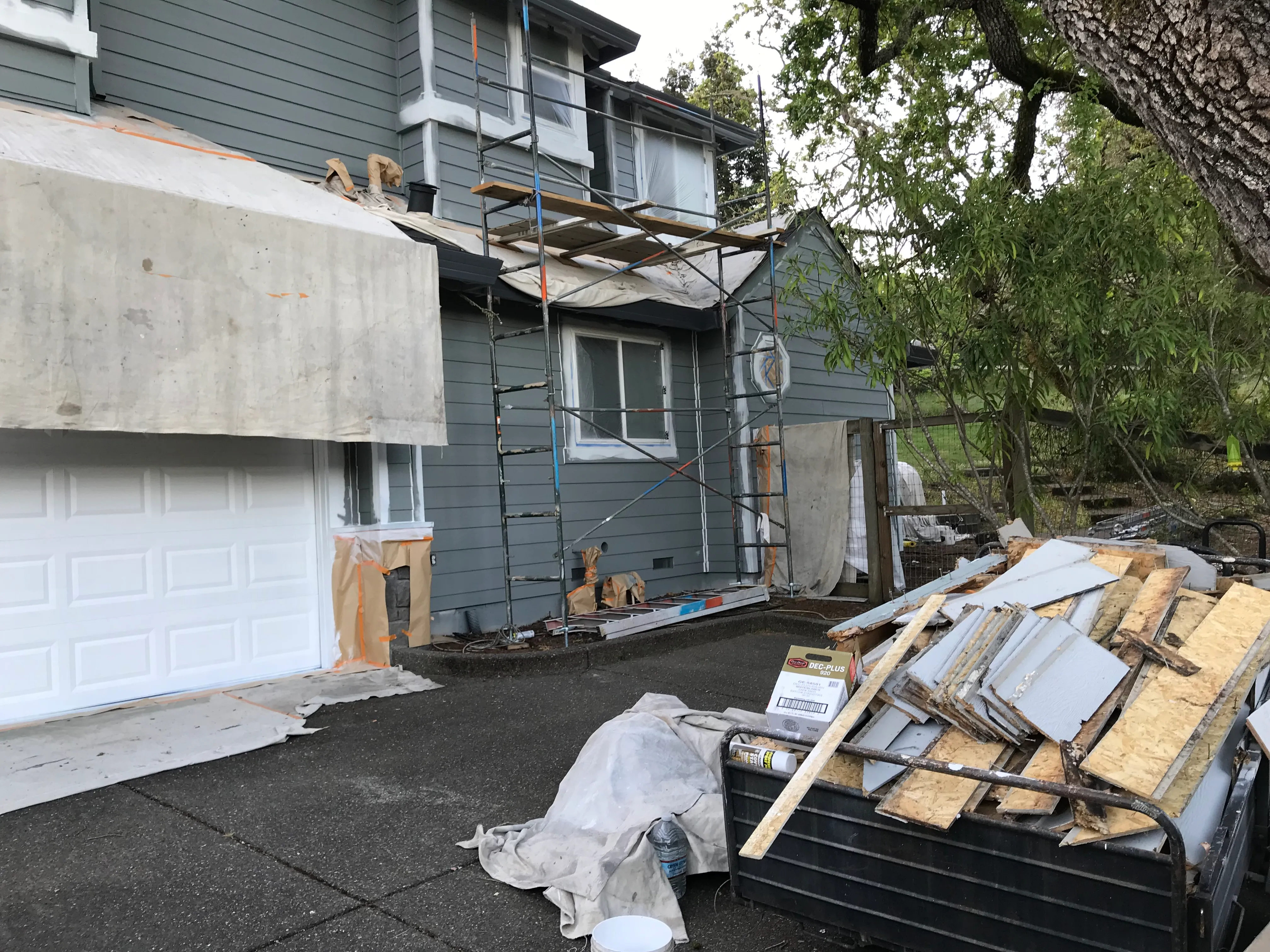 Picture of A home under transformation reveals the dedication of Solidarity Painting, Inc. as scaffolding and protective coverings indicate a meticulous exterior renovation process. Known for their highest quality outcomes, the company ensures every detail contributes to customer satisfaction. Copyright ©2025 Diamond Certified Resource

 - Solidarity Painting, Inc.